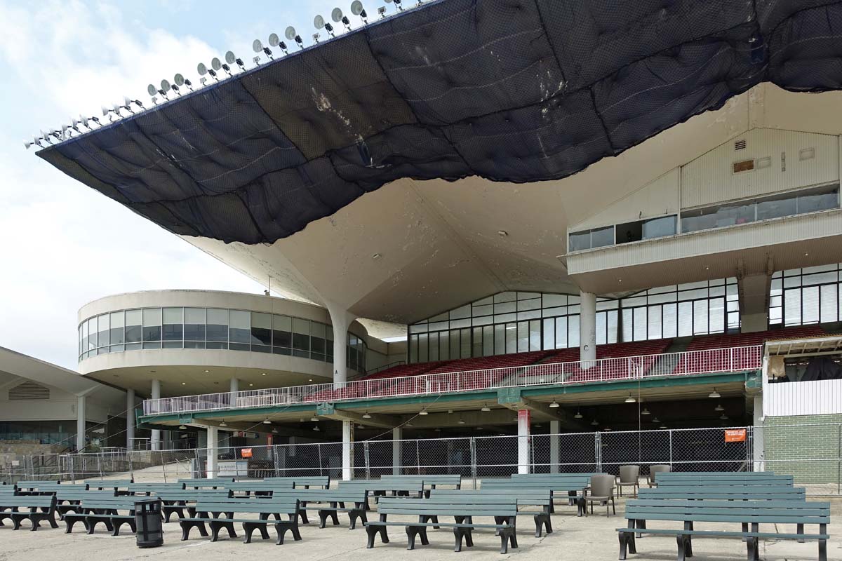 General view 2 of the Scioto Downs grandstand showing the thin-shell concrete roof in July 2019.